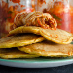 Kimchi and seafood fusion-style pancakes, topped with homemade kimchi - Diversivore.com