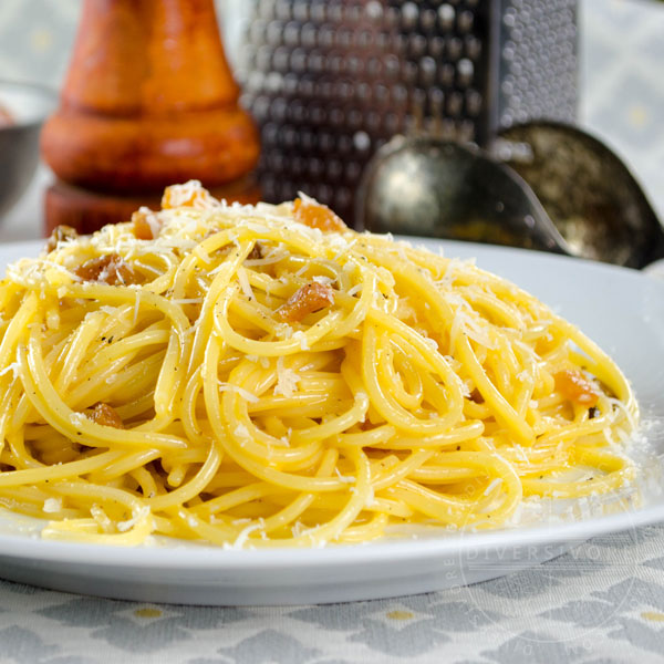 Spaghetti Carbonara with guanciale on a white plate