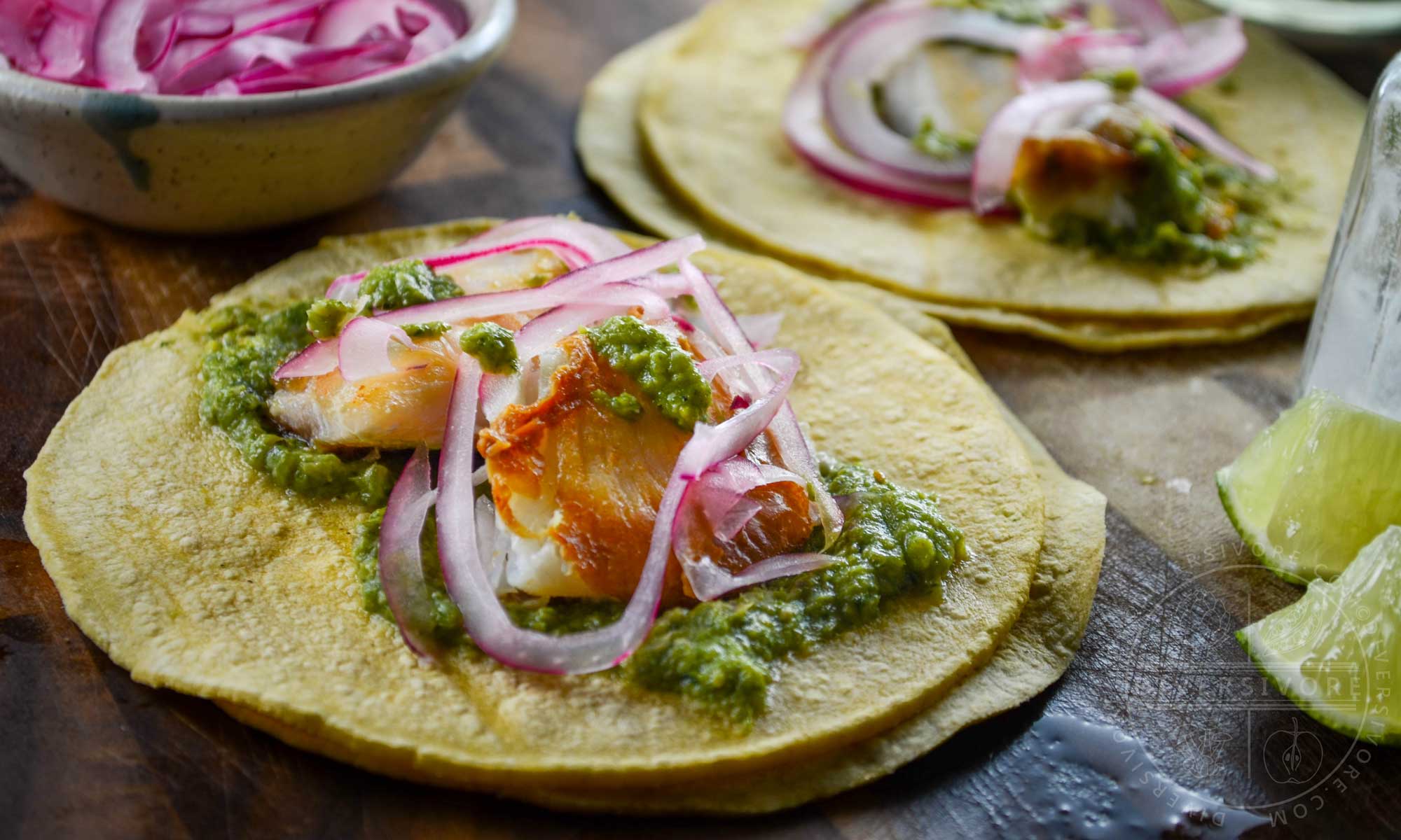 Fish tacos with cilantro corn salsa and pickled red onions