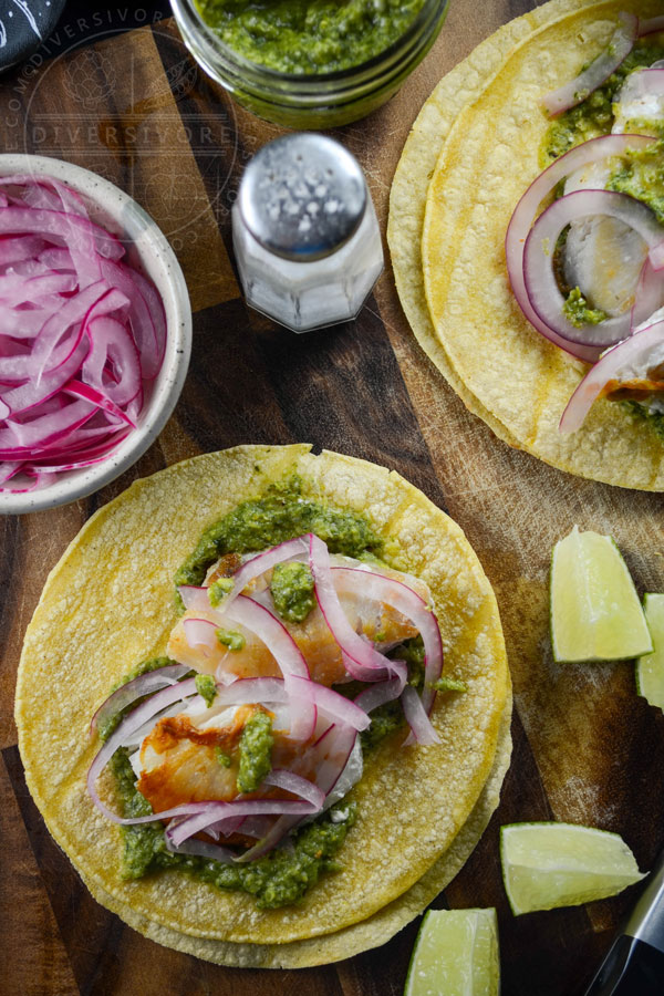 Fish tacos with cilantro corn salsa and pickled red onions