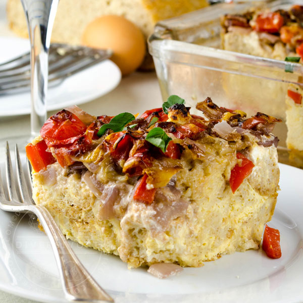 Goat cheese and emmental strata with peppers and onions sauteed in red wine