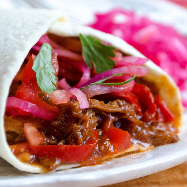 Carne Entomatada - beef in a Mexican-spiced tomato sauce, served here in a flour tortilla shell