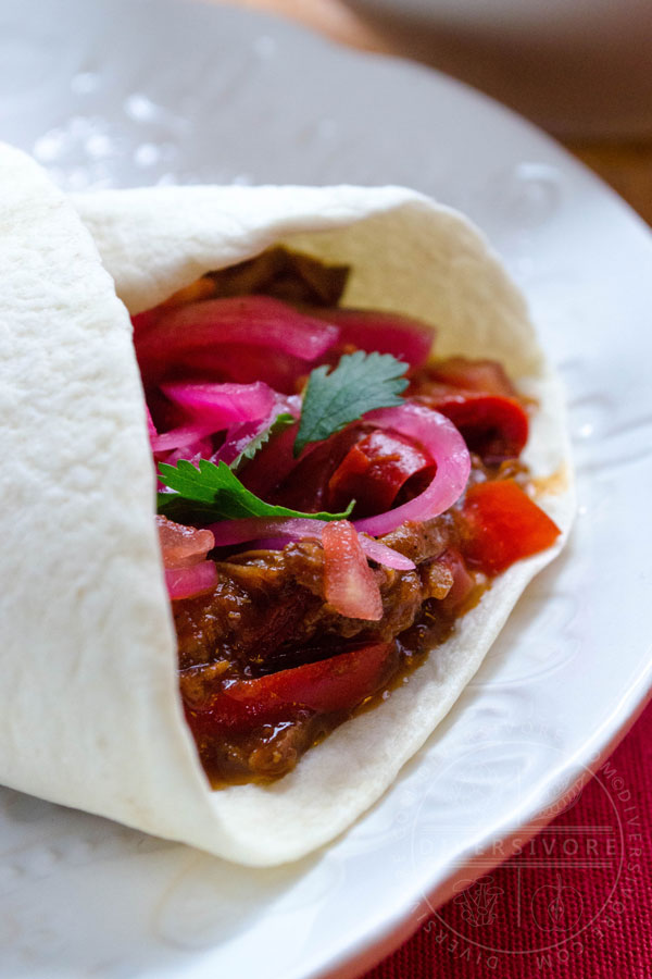 Carne Entomatada - beef in a Mexican-spiced tomato sauce, served here in a flour tortilla shell