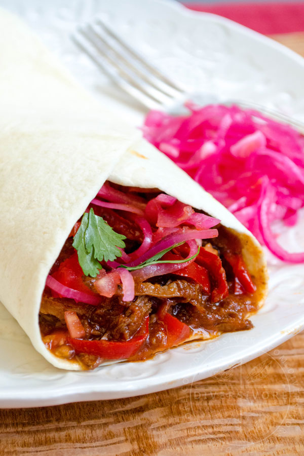 Carne Entomatada - beef in a Mexican-spiced tomato sauce, served here in a flour tortilla shell