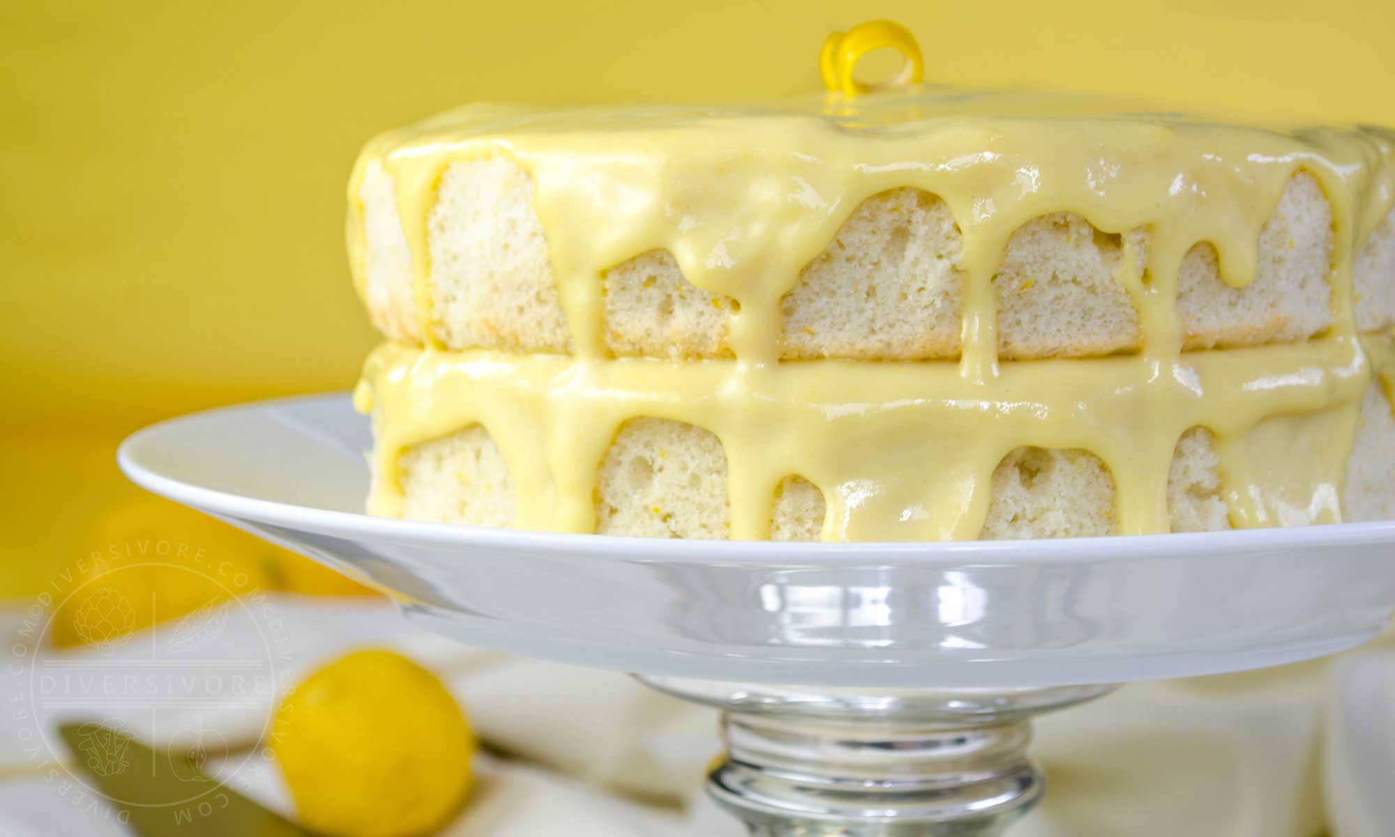 Lemon Whip Cake with Dairy-Free Lemon Curd, shown on a raised cake platter