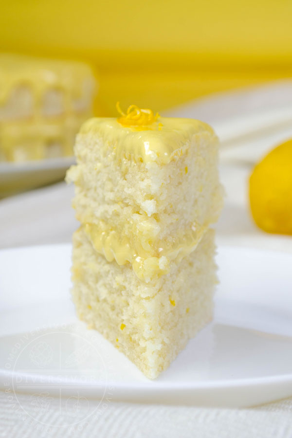 A slice of Lemon Whip Cake with Dairy-Free Lemon Curd served on a white plate