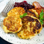 Potatisbullar - Swedish potato cakes - served with cranberries and bacon - Diversivore.com