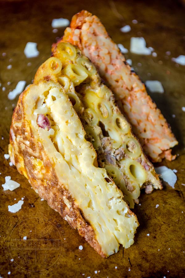 Three slices of frittata di pasta lined up and showing the texture of the pasta