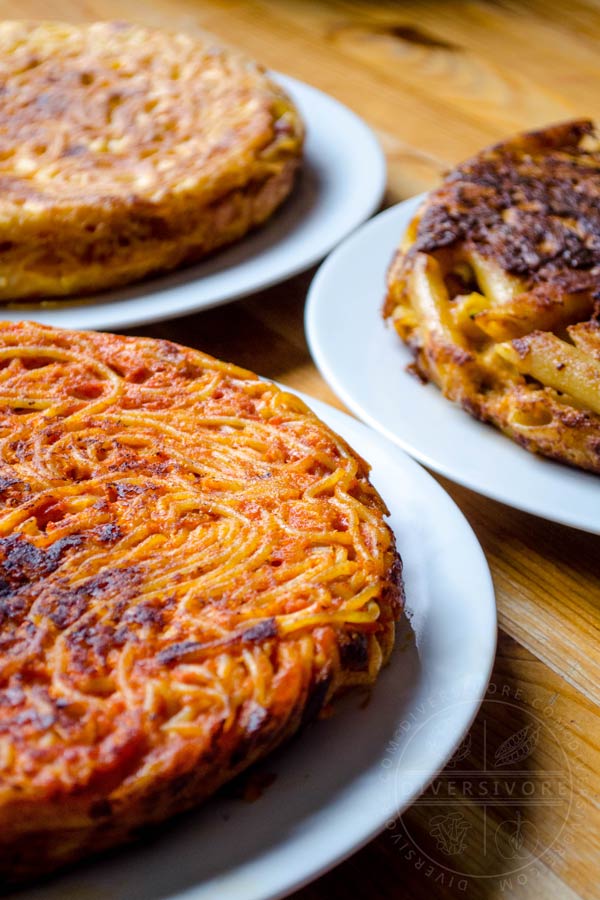 Three types of frittata di pasta on white plates