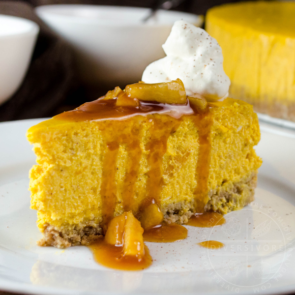 Pumpkin apple cheesecake with apple caramel sauce, whipped cream, and a gluten-free oat crust