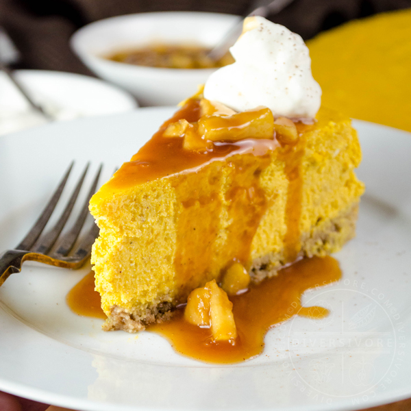 Pumpkin apple cheesecake with apple caramel sauce, whipped cream, and a gluten-free oat crust