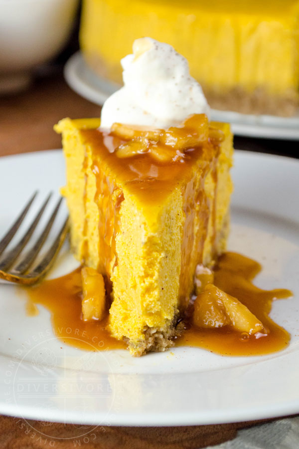 Pumpkin apple cheesecake with apple caramel sauce, whipped cream, and a gluten-free oat crust