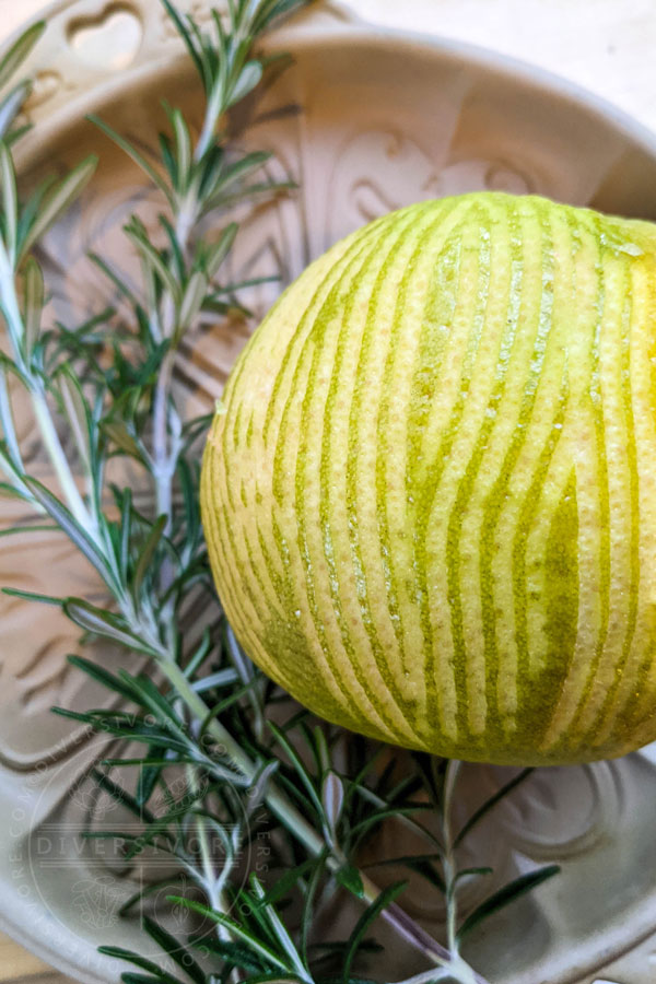 Zested grapefruir and rosemary sitting in a shortbread pan