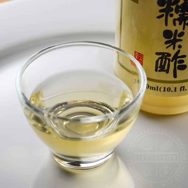 Rice vinegar (komezu) in a small glass cup