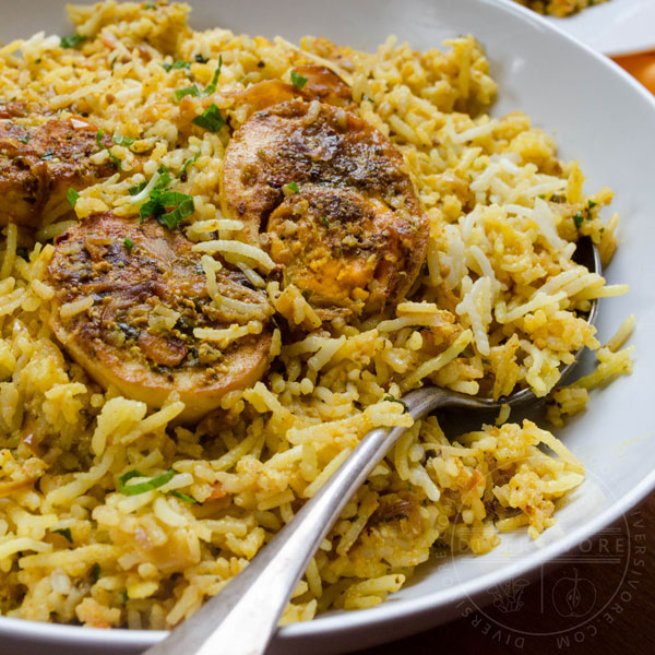 Hyderabadi egg biryani in a large white serving bowl