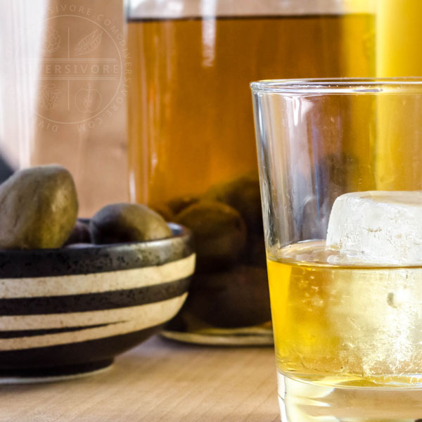 Umeshu on the rocks with leftover green apricots