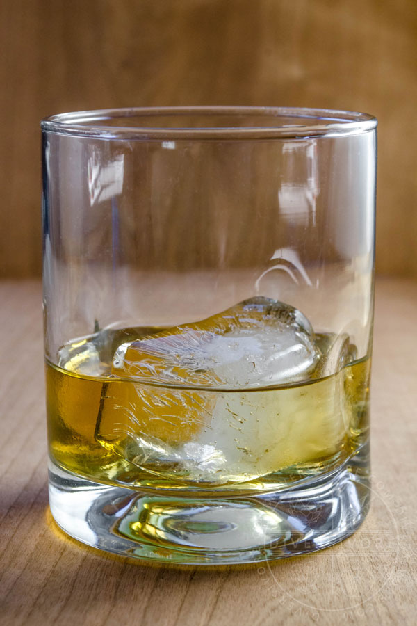 Umeshu on the rocks in a glass tumbler