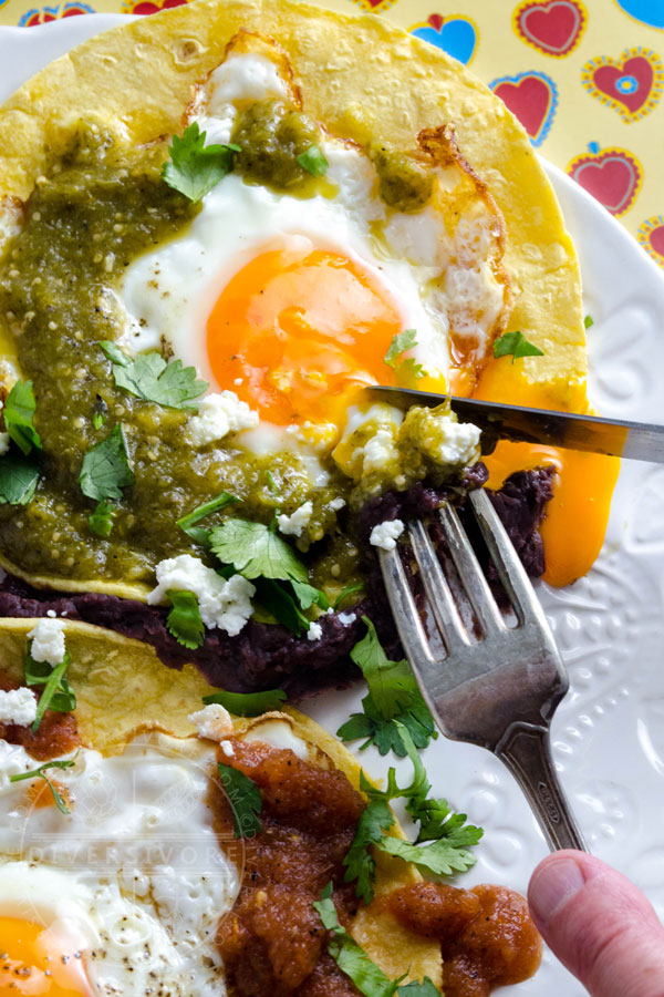 Huevos Divorciados (Fried eggs served with two kinds of salsa)