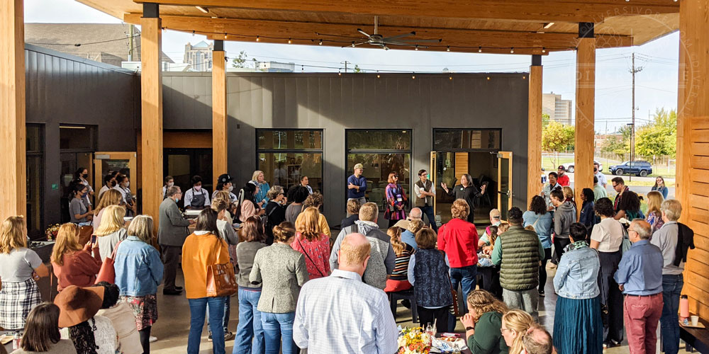 IACP conference attendees listening to director Amanda Storey at the Jones Valley Teaching Farm in Birmingham, Alabama.