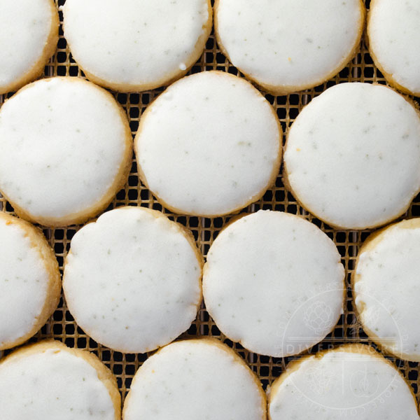 Bay leaf and lemon shortbread cookies tiled on a cooling rack