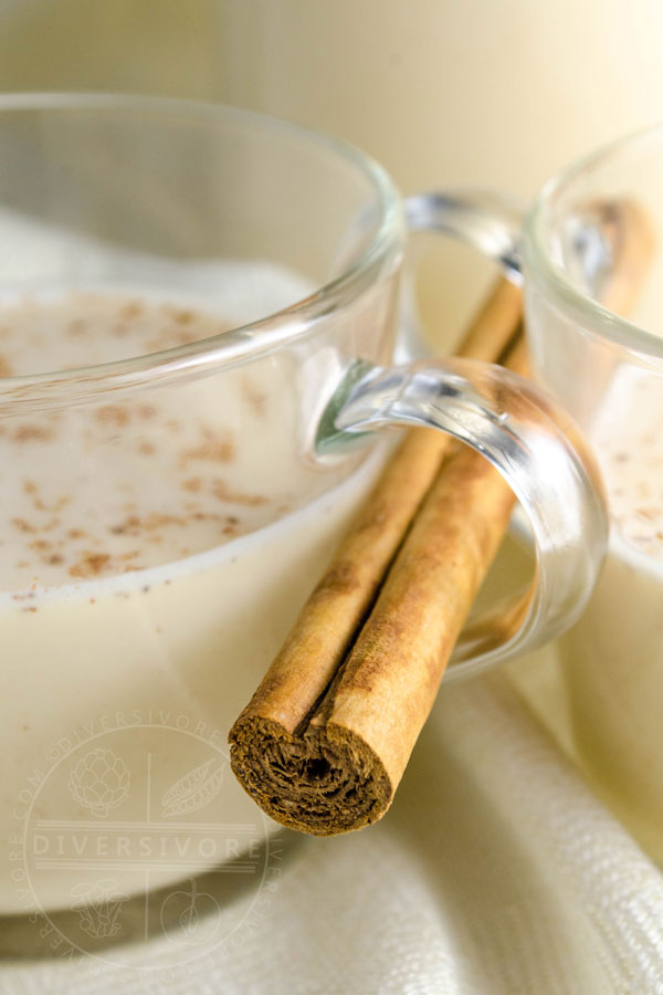 Coquito in glass mugs with a true cinnamon stick