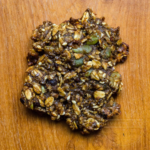 High protein breakfast cookie with pepitas, cacao nibs, caramel, sesame seeds, and cinnamon