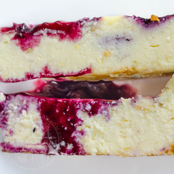 Two slices of ricotta cheesecake showing the difference in texture between mascarpone (top) and cream cheese (bottom)