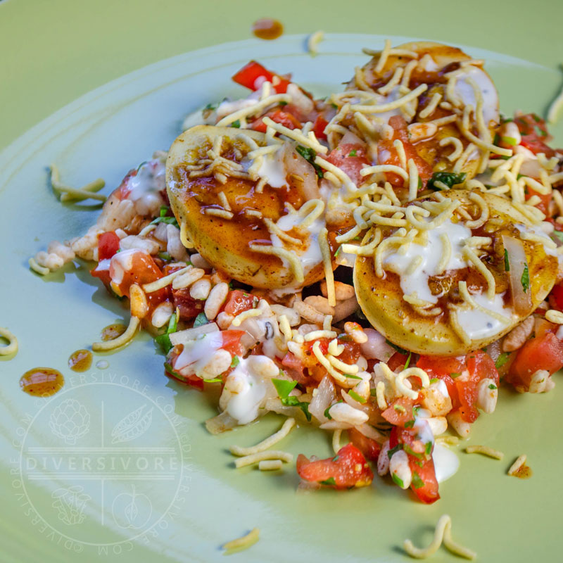 Egg chaat with puffed rice and chutneys