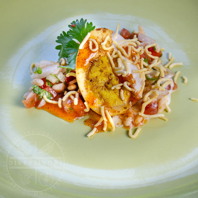 Egg chaat with puffed rice and chutneys