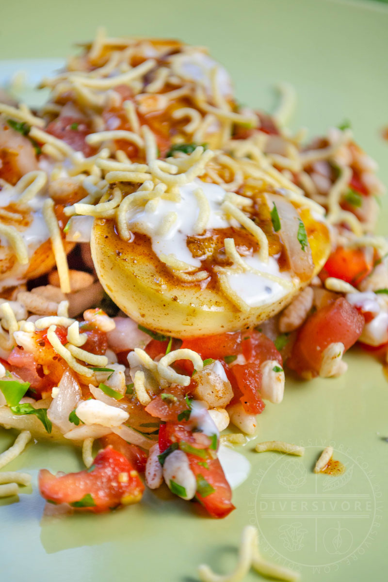Egg chaat with puffed rice and chutneys