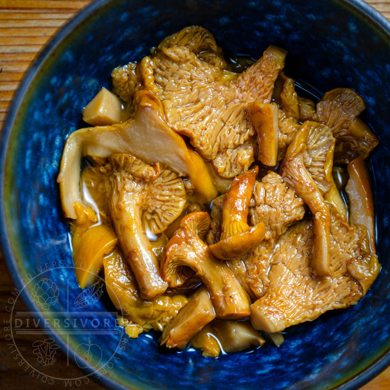 Pickled chanterelle mushrooms in a blue bowl